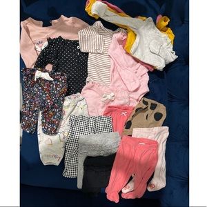 bundle of newborn onesies and pants